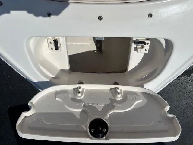 Slide: The Image of 2002 Chaparral 196 SSi boat storage compartment, open and empty, on a sunny day. - 14