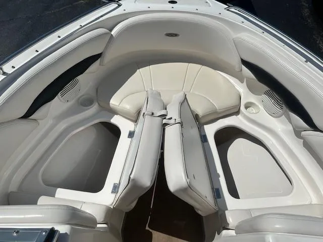 Slide: The Image of Interior view of 2002 Chaparral 196 SSi boat, featuring white seating and storage compartments. - 15
