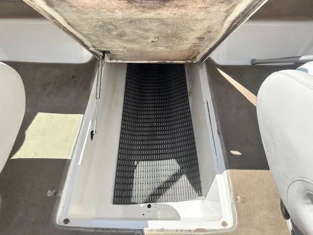 Slide: The Image of Open storage compartment in 2002 Chaparral 196 SSi boat interior. - 16