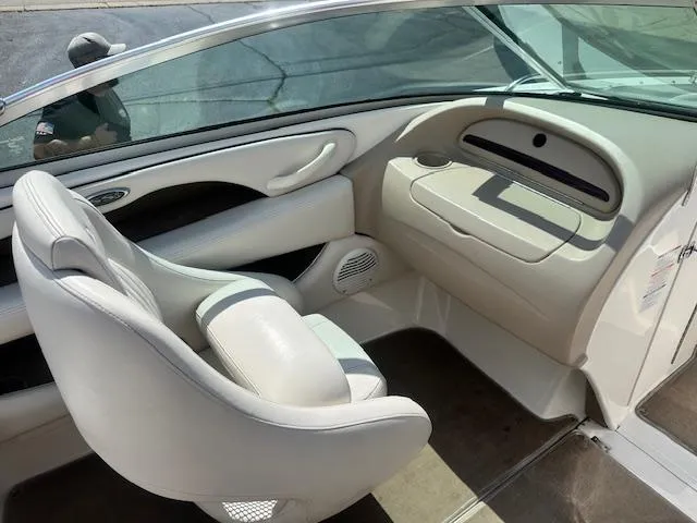 Slide: The Image of Interior of 2002 Chaparral 196 SSi boat with white seating and dashboard. - 17