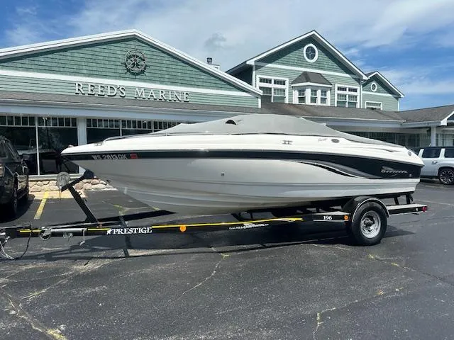 Slide: The Image of 2002 Chaparral 196 SSi boat on trailer outside Reed's Marine dealership. - 23