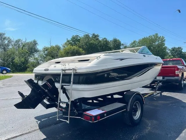 Slide: The Image of 2002 Chaparral 196 SSi boat on trailer, parked outdoors on a sunny day. - 3