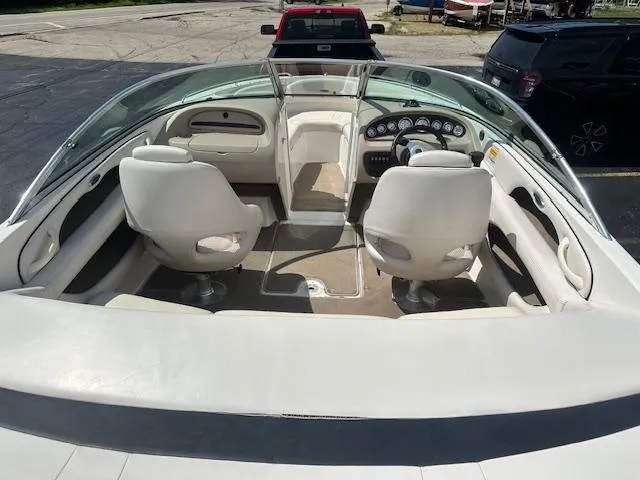 Slide: The Image of Interior view of a 2002 Chaparral 196 SSi boat with white seating and dashboard. - 6