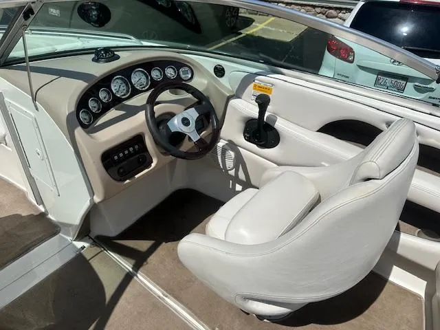 Slide: The Image of 2002 Chaparral 196 SSi boat interior with steering wheel and dashboard controls. - 7