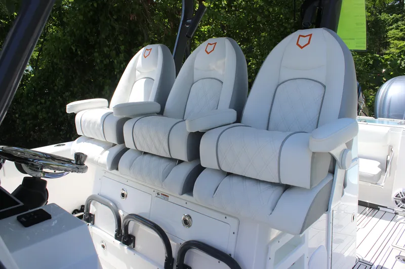 Slide: The Image of 2025 Sea Fox 328 Commander boat with luxurious white seating and modern helm design. - 15
