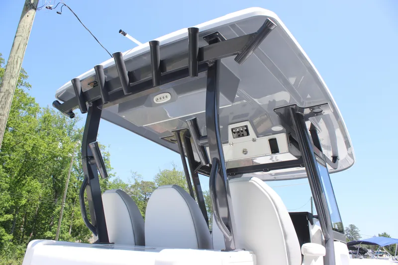 Slide: The Image of 2025 Sea Fox 328 Commander boat with T-top and rod holders, viewed from below. - 20