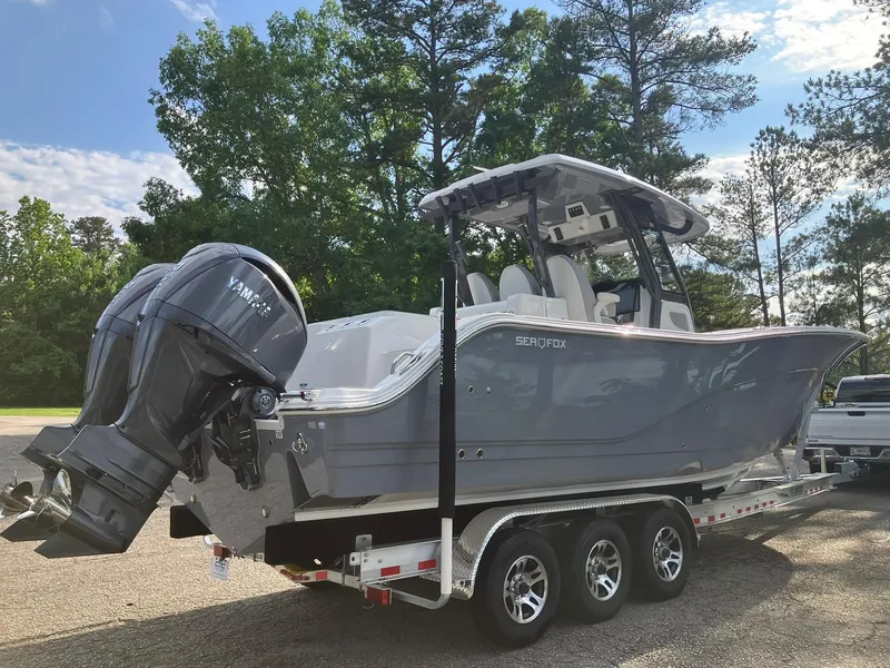 Slide: The Image of 2025 Sea Fox 328 Commander boat on trailer, featuring dual Yamaha outboard engines. - 7