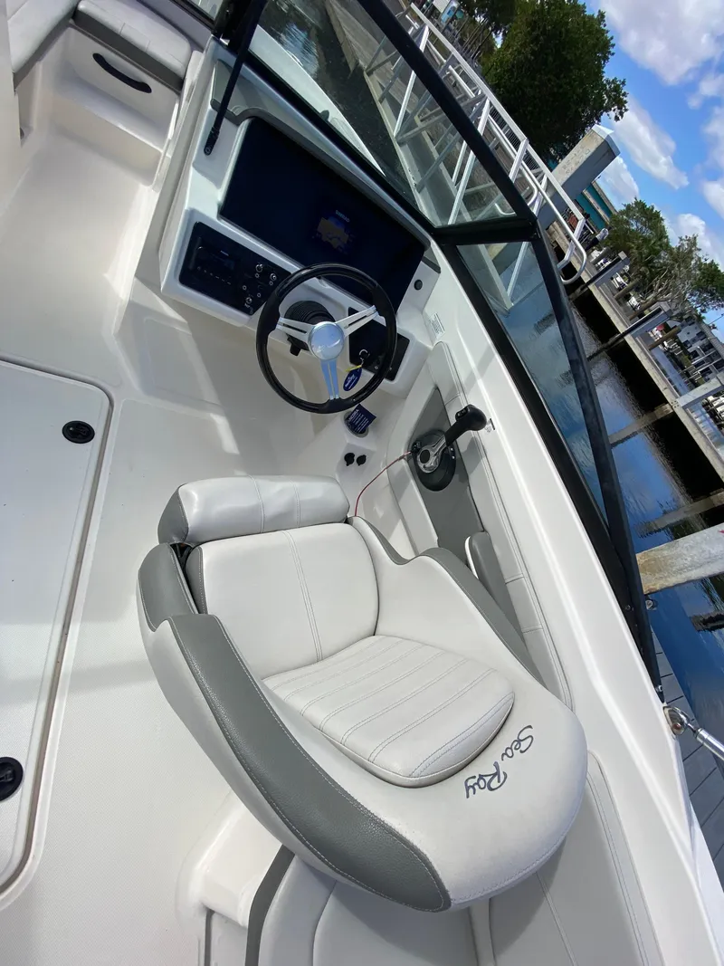 Slide: The Image of 2020 Sea Ray SPX 210 Outboard boat interior with steering wheel and seating. - 33