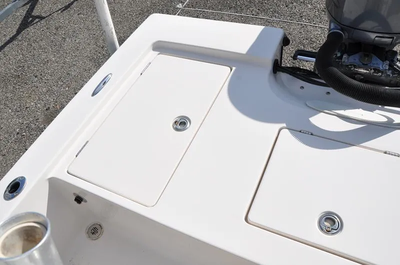 Slide: The Image of 2005 Pathfinder 2200 boat deck with storage compartments and engine detail. - 10