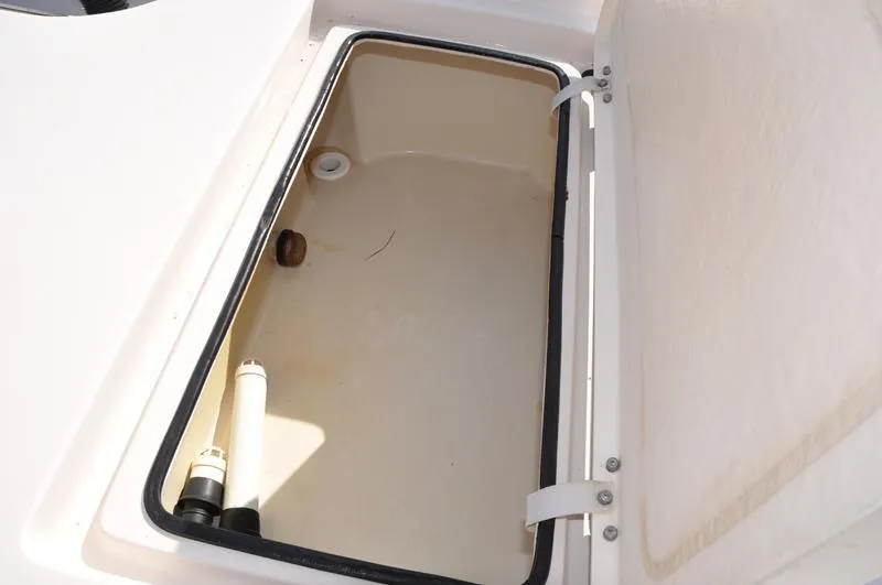 Slide: The Image of Open storage compartment on a 2005 Pathfinder 2200 boat. - 15