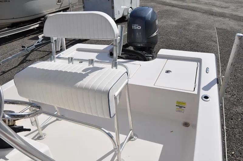 Slide: The Image of 2005 Pathfinder 2200 boat with Yamaha 150 engine and white seating. - 16