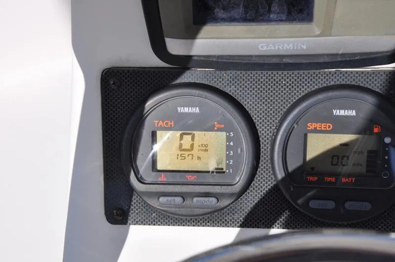 Slide: The Image of Yamaha tachometer and speedometer on 2005 Pathfinder 2200 boat dashboard with Garmin display. - 18