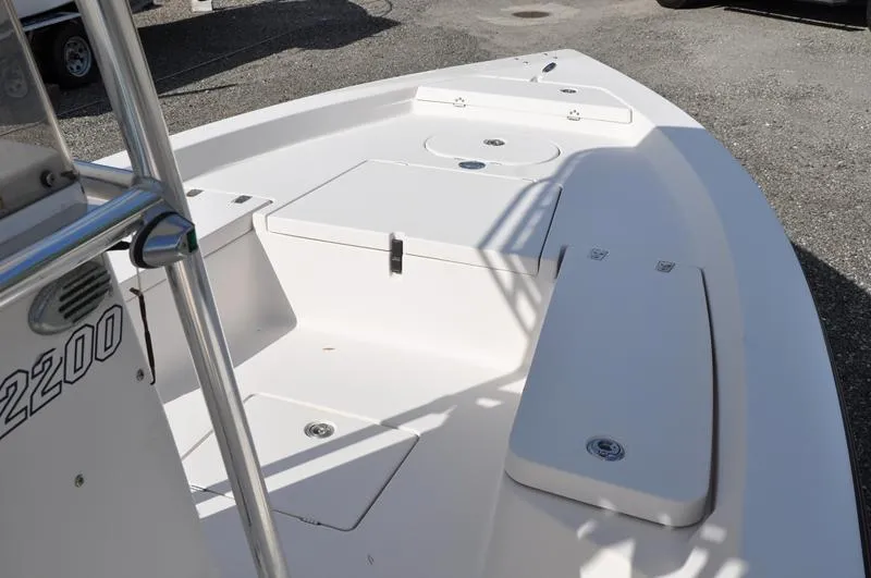 Slide: The Image of 2005 Pathfinder 2200 boat deck with storage compartments and seating. - 24