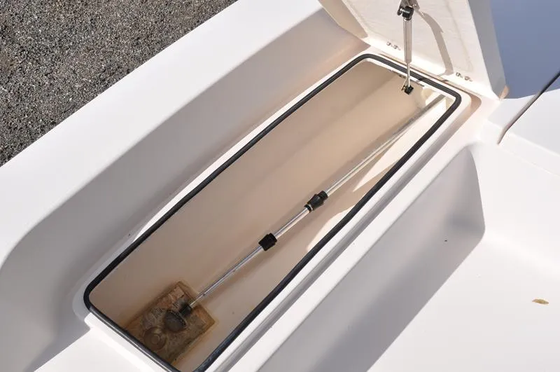 Slide: The Image of Open storage compartment on a 2005 Pathfinder 2200 boat, showing interior details. - 26