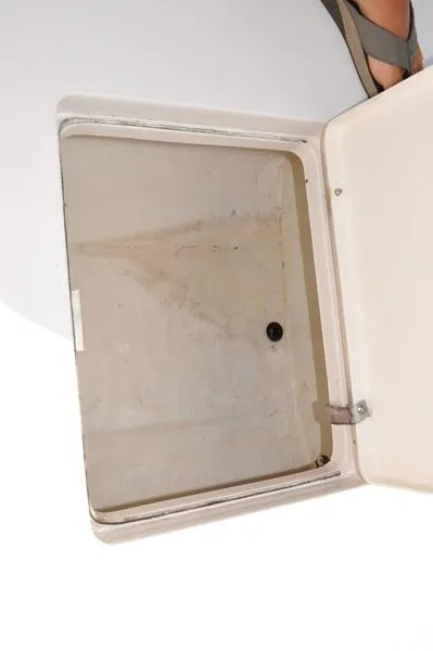 Slide: The Image of Open storage compartment on a 2005 Pathfinder 2200 boat. - 29