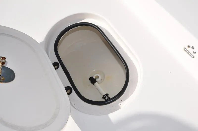 Slide: The Image of Open storage compartment on a 2005 Pathfinder 2200 boat. - 30