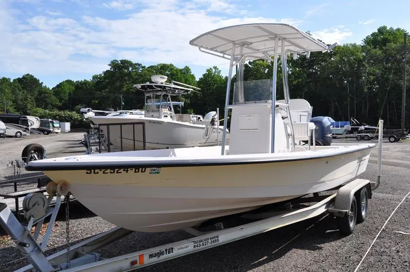 Slide: The Image of 2005 Pathfinder 2200 boat on trailer in outdoor storage area. - 6