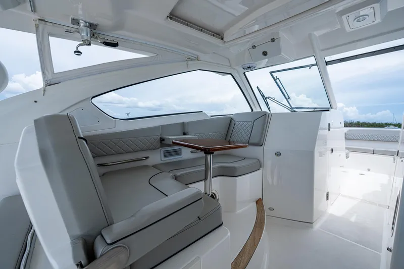 Slide: The Image of 2023 Pursuit DC 365 Dual Console interior with sleek seating and modern design. - 40