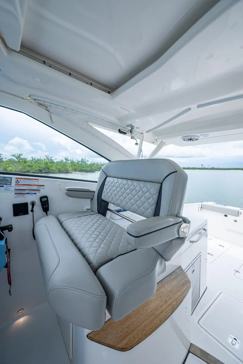 Slide: The Image of 2023 Pursuit DC 365 Dual Console boat interior with luxurious seating and modern design. - 43