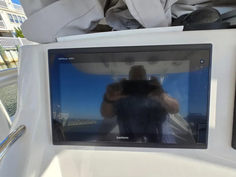 Slide: The Image of Garmin GPSMAP XSV on 2017 Regulator 28 boat dashboard. - 23