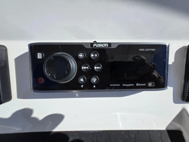 Slide: The Image of Fusion MS-UD750 audio system on 2017 Regulator 28 boat dashboard. - 31