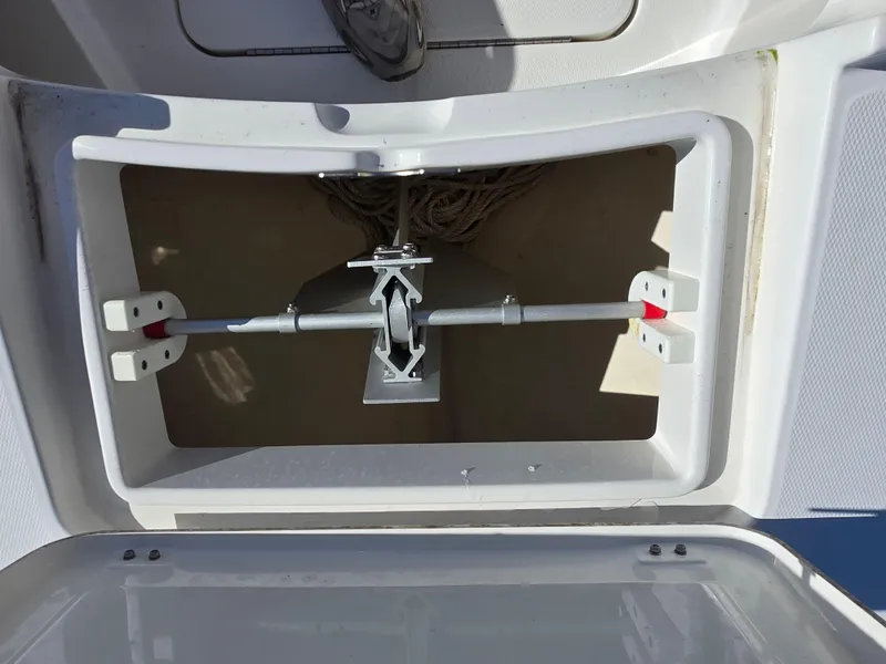 Slide: The Image of Anchor storage compartment on a 2017 Regulator 28 boat, featuring secure anchor placement. - 33