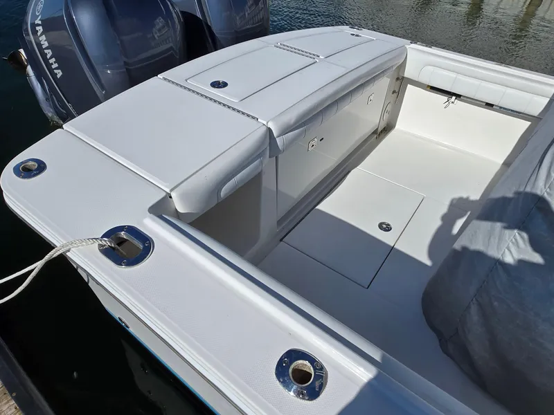 Slide: The Image of 2017 Regulator 28 boat with Yamaha engines, featuring spacious deck and seating area. - 9