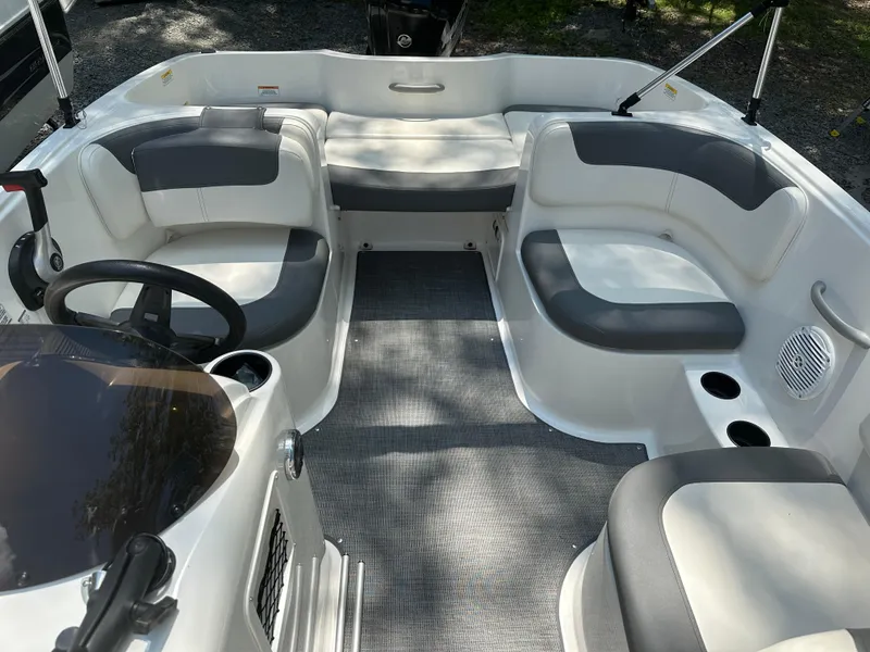 Slide: The Image of 2019 Bayliner Element E16 boat interior with gray seating and steering wheel. - 9