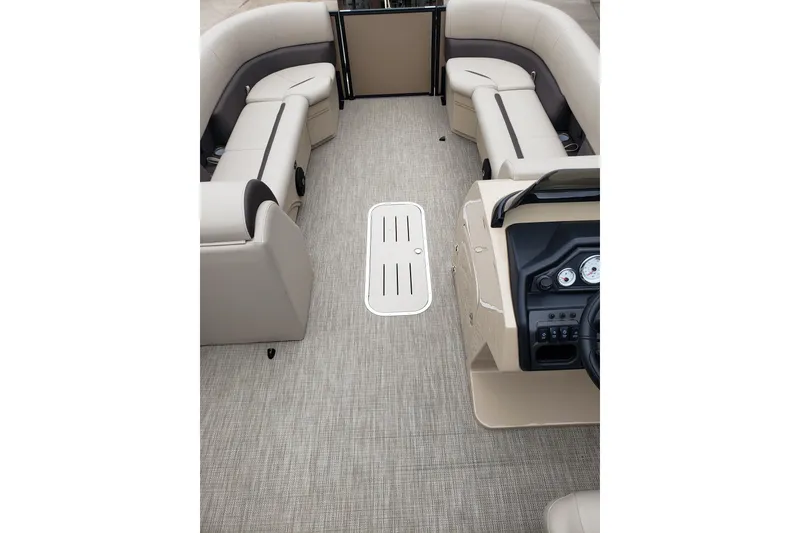 Slide: The Image of Interior of 2026 Bentley Pontoons Legacy 243 Cruise with beige seating and dashboard. - 11