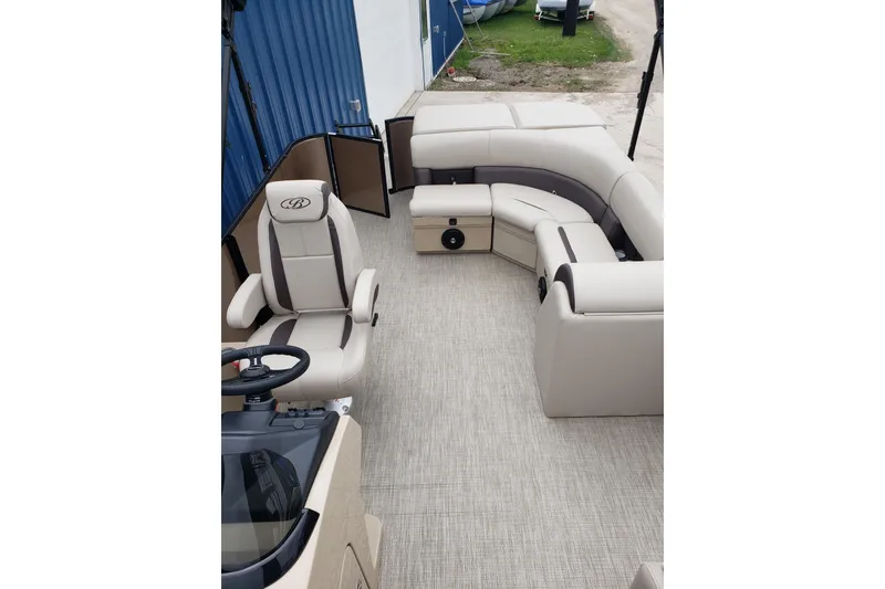 Slide: The Image of Luxurious interior of 2026 Bentley Pontoons Legacy 243 Cruise with plush seating and helm. - 14