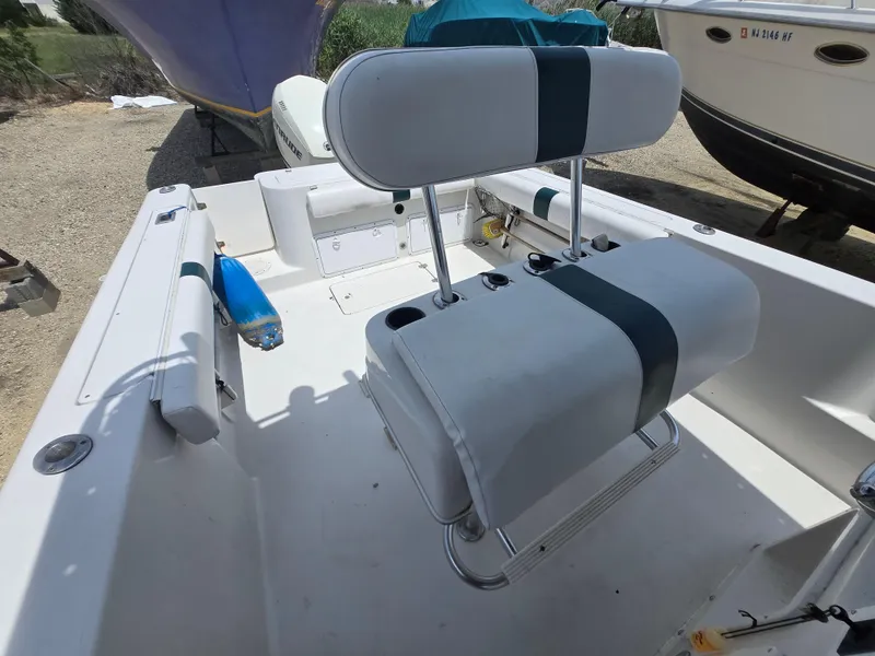 Slide: The Image of 1995 Pro-Line 240 Center Console boat interior with seating and storage compartments. - 10