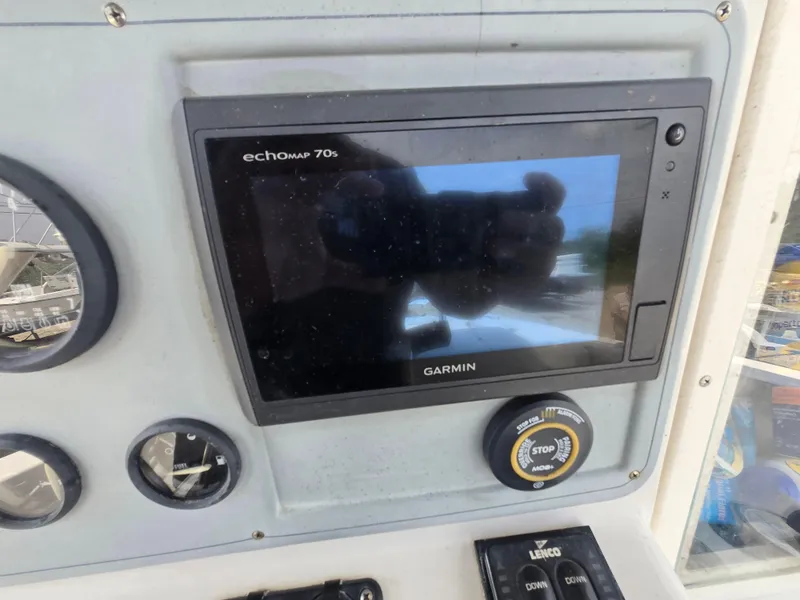 Slide: The Image of Garmin echoMAP 70s on 1995 Pro-Line 240 Center Console dashboard. - 14