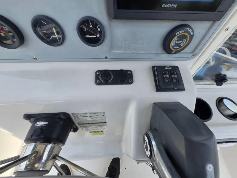 Slide: The Image of 1995 Pro-Line 240 Center Console dashboard with gauges, controls, and Garmin display. - 16
