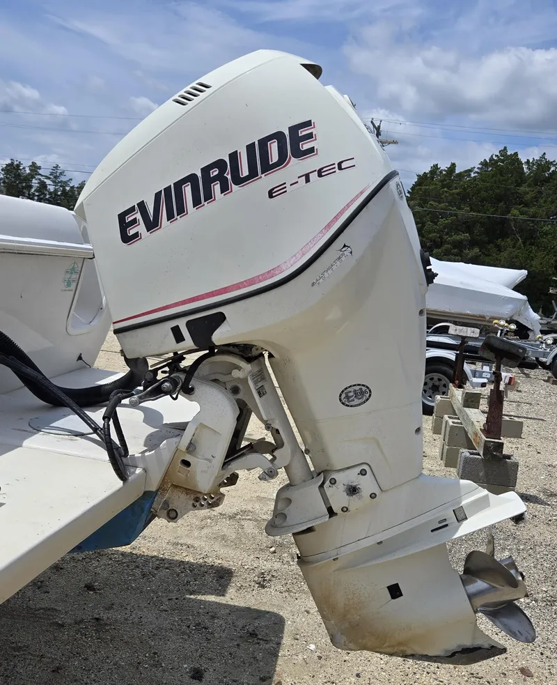 Slide: The Image of Evinrude E-TEC outboard motor on 1995 Pro-Line 240 Center Console boat. - 6