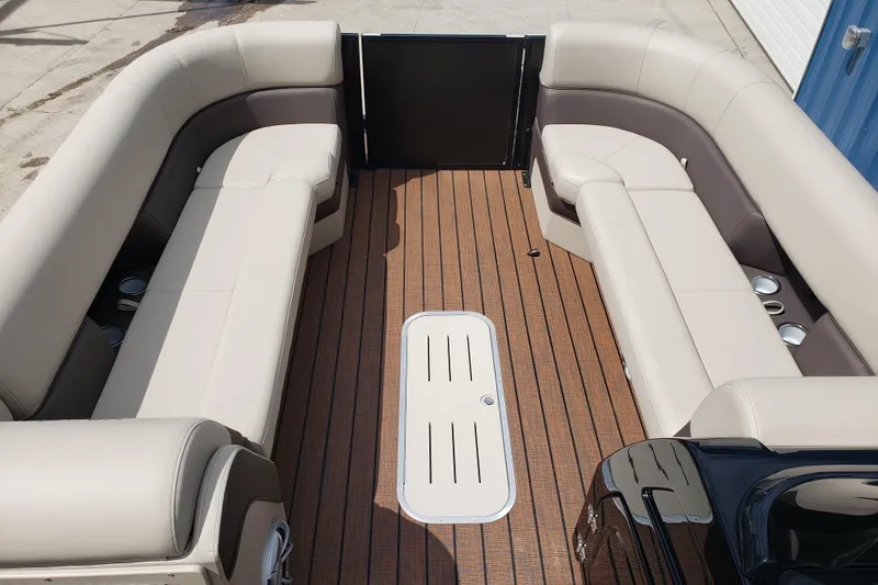 Slide: The Image of 2026 Bentley Pontoons Elite 253 QSB interior with luxurious seating and wood-style flooring. - 13