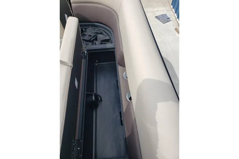 Slide: The Image of Open storage compartment in 2026 Bentley Pontoons Elite 253 QSB boat. - 14