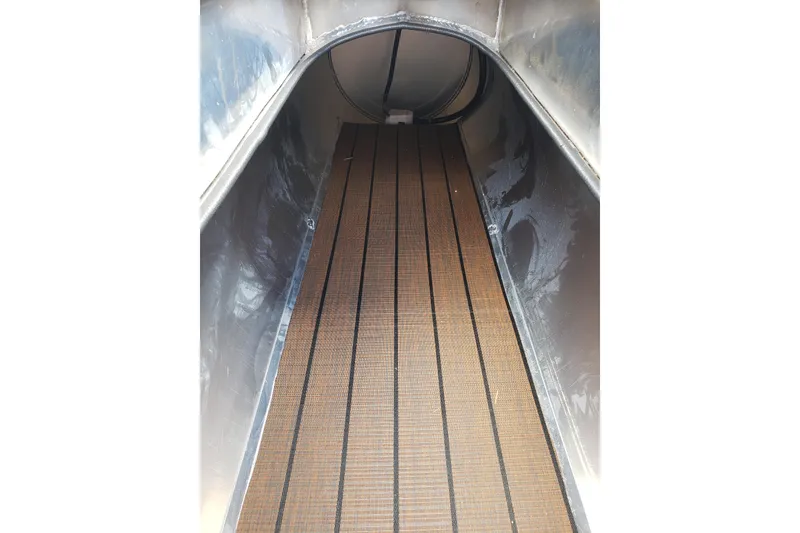 Slide: The Image of Interior view of 2026 Bentley Pontoons Elite 253 QSB with wooden flooring. - 19