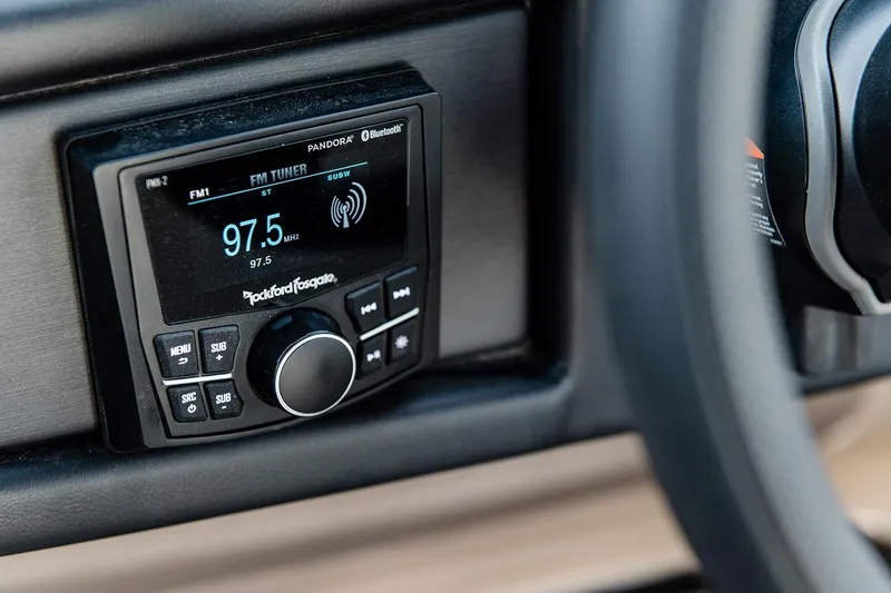 Slide: The Image of 2025 Bentley Pontoons Elite 253 QSB stereo system displaying FM tuner at 97.5 MHz. - 2