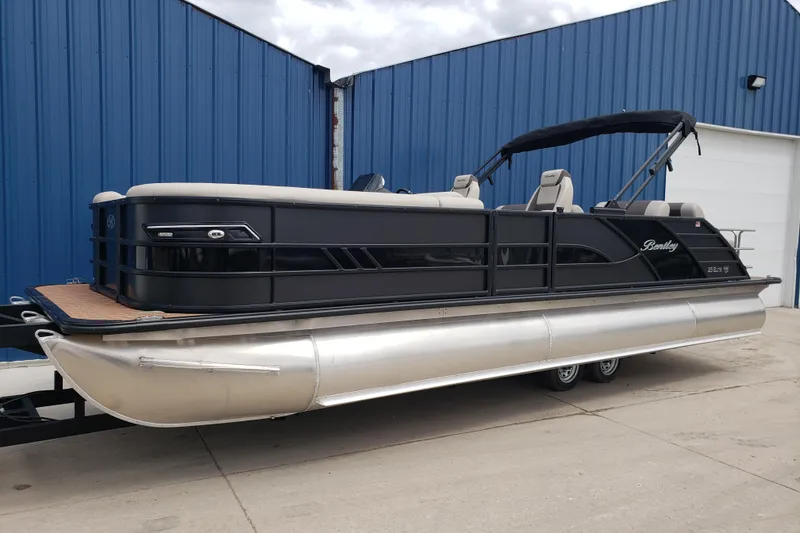 Slide: The Image of 2026 Bentley Pontoons Elite 253 QSB, sleek black design, side view. - 21