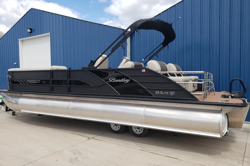 Slide: The Image of 2025 Bentley Pontoons Elite 253 QSB stereo system displaying FM tuner at 97.5 MHz. - 23