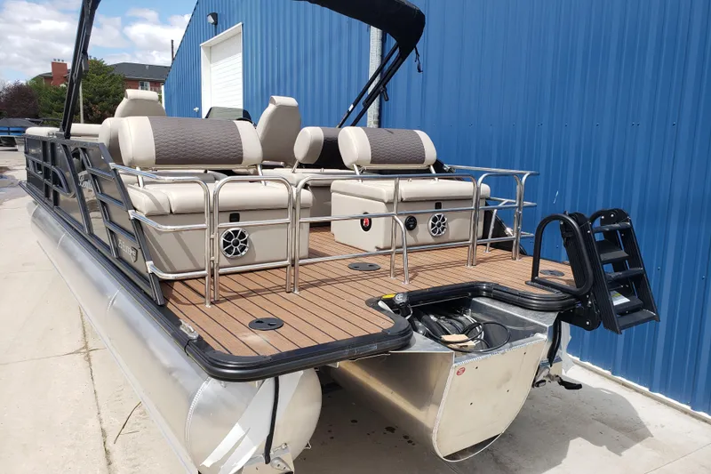 Slide: The Image of Foldable table with cup holders on 2025 Bentley Pontoons Elite 253 QSB. - 24