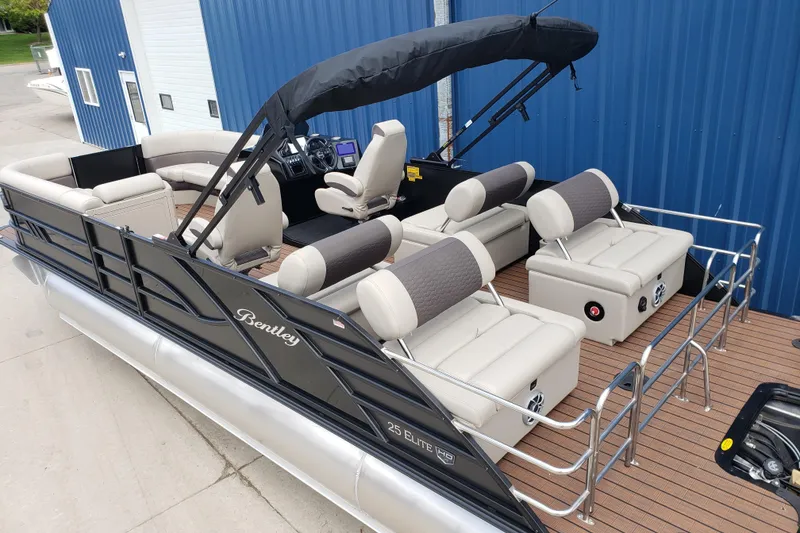 Slide: The Image of 2026 Bentley Pontoons Elite 253 QSB with luxurious seating and sleek design. - 5