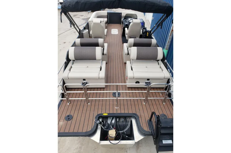 Slide: The Image of 2026 Bentley Pontoons Elite 253 QSB with luxurious seating and sleek deck design. - 6