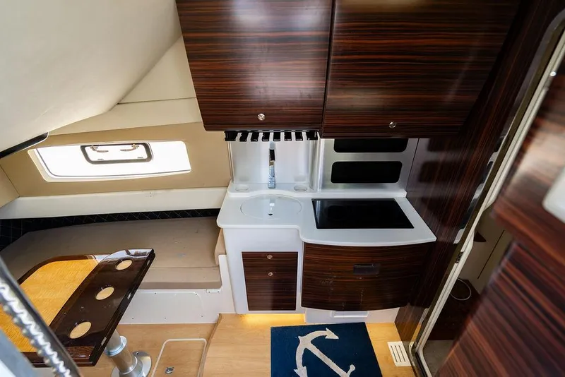 Slide: The Image of Luxurious interior of 2018 Scout 420 LXF yacht with modern kitchen and seating area. - 20
