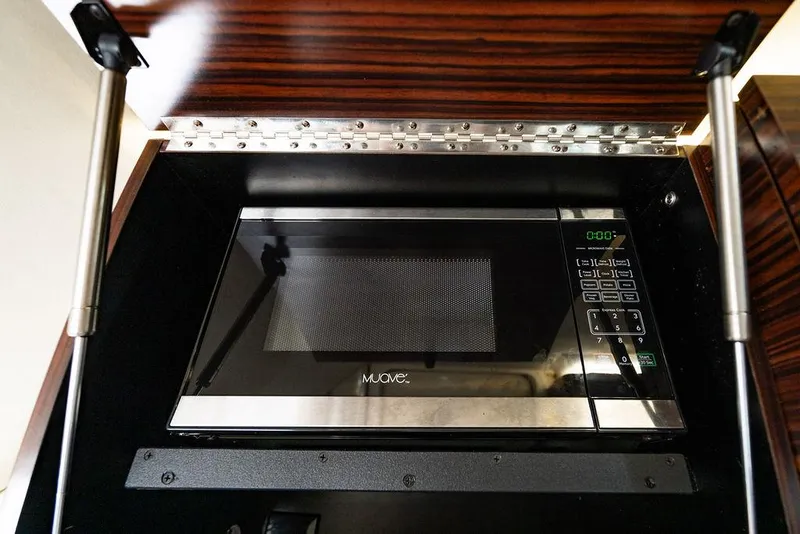 Slide: The Image of Built-in microwave in 2018 Scout 420 LXF boat kitchen cabinet. - 30