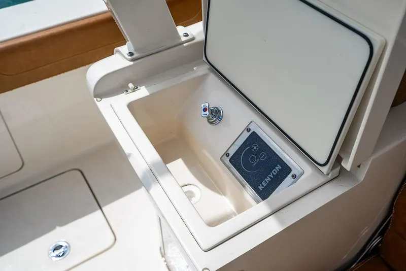 Slide: The Image of Kenyon grill on 2018 Scout 420 LXF boat, featuring a sleek built-in design. - 32