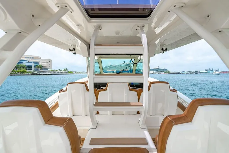 Slide: The Image of 2018 Scout 420 LXF boat interior with luxurious seating and ocean view. - 40