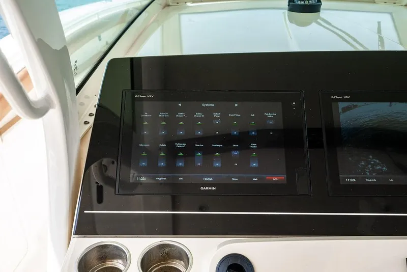 Slide: The Image of Control panel of a 2018 Scout 420 LXF boat with Garmin display. - 49