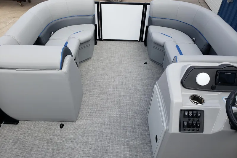Slide: The Image of 2026 Bentley Pontoons 223 Bolt interior with gray seating and modern helm. - 12