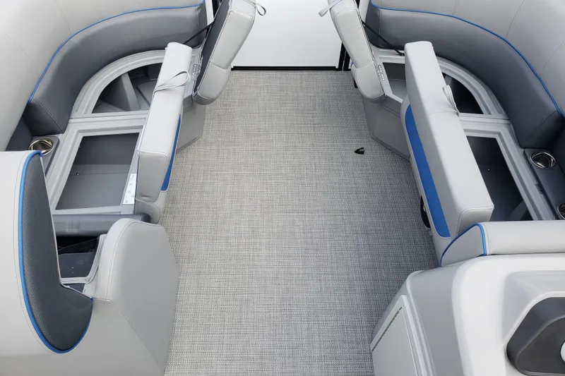 Slide: The Image of 2026 Bentley Pontoons 223 Bolt interior with gray seating and storage compartments. - 13